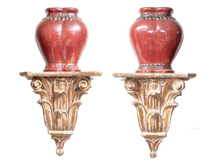 A pair of sculpture large ceramic wall shelves displaying oxblood red glazed ceramic urns